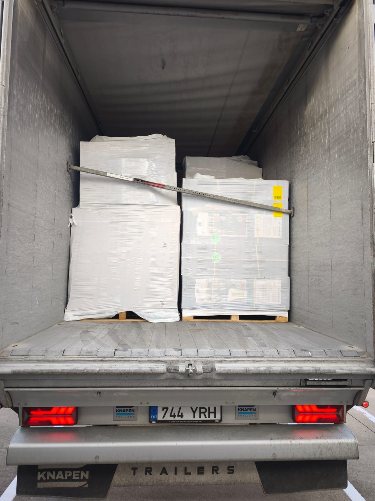 Interior of an Alvora Logistics Knapen walking floor trailer — slatted self-unloading floor with palletised cargo
