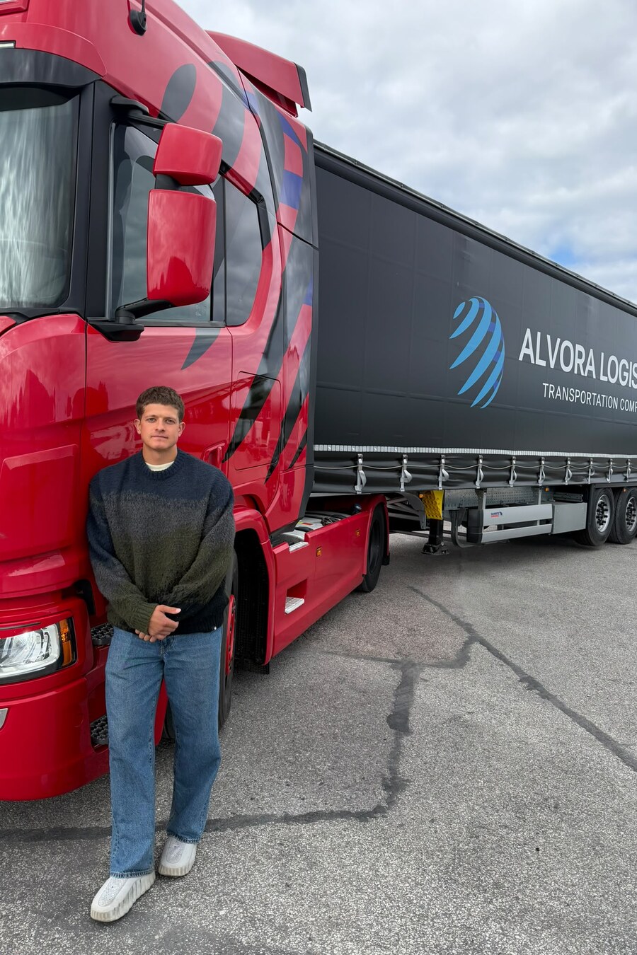 Janar Aniste, Logistics Specialist at Alvora Logistics, with the fleet